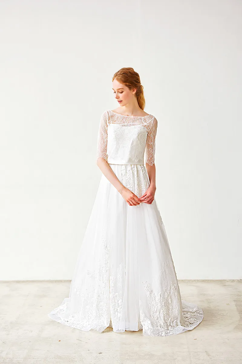 ---A-line wedding dress with sweetheart neckline and sheer quarter-length sleeves with lace appliqués--
