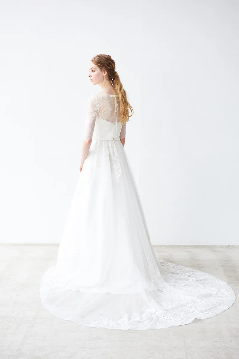 ---A-line wedding dress with sweetheart neckline and sheer quarter-length sleeves with lace appliqués--