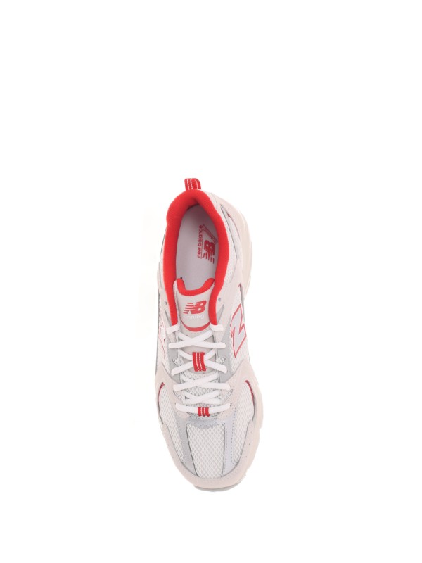 530 white red sneakers