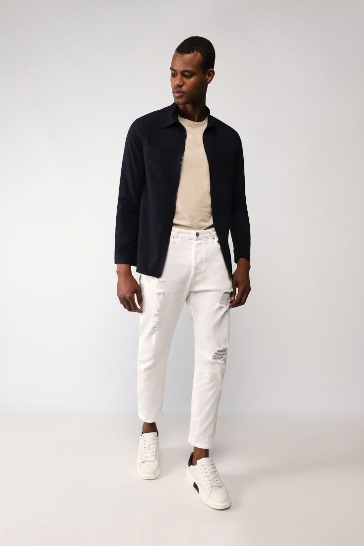 Pantaloni slim-fit monocolour con strappi